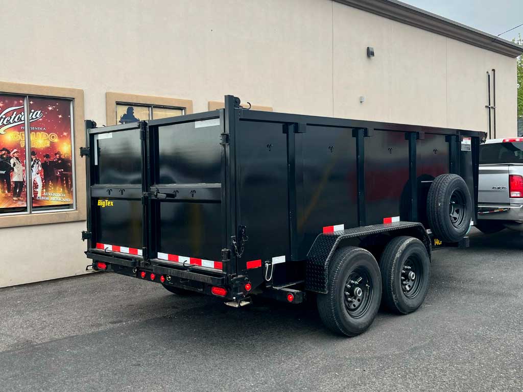 High-capacity dump trailer hauling wood chips after stump grinding in Pasco WA